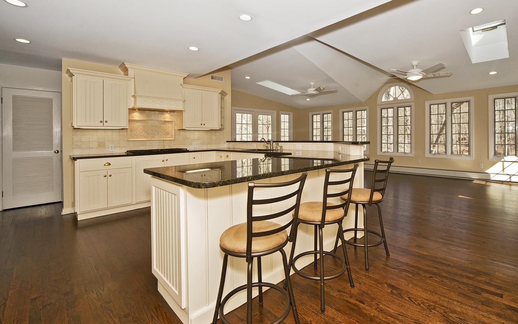 30 Mayapple Road Wilton, CT 06897 - Photo 6 of 24 a kitchen with stainless steel appliances granite countertop a stove and white cabinets with wooden floor