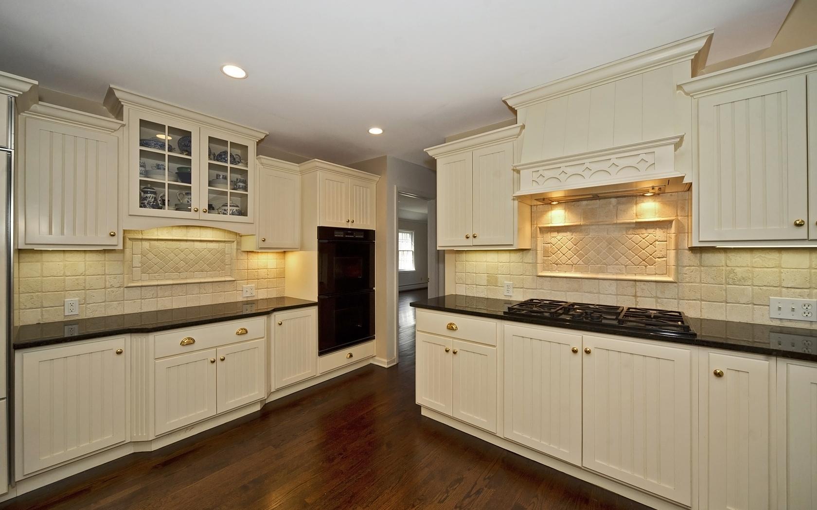 30 Mayapple Road Wilton, CT 06897 - Photo 8 of 24 a kitchen with granite countertop white cabinets and a sink