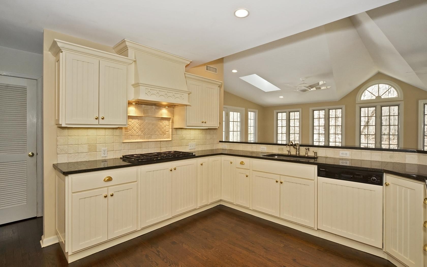 30 Mayapple Road Wilton, CT 06897 - Photo 9 of 24 a kitchen with granite countertop white cabinets and a sink
