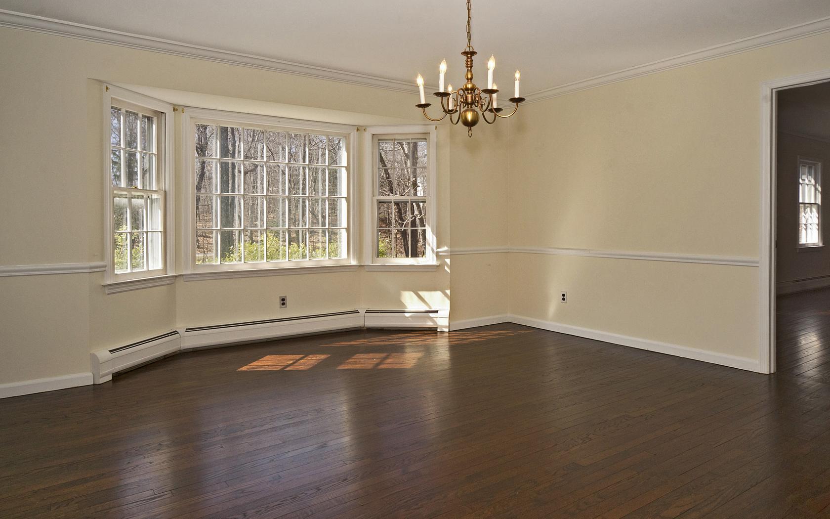 30 Mayapple Road Wilton, CT 06897 - Photo 10 of 24 a view of an empty room with wooden floor and a window