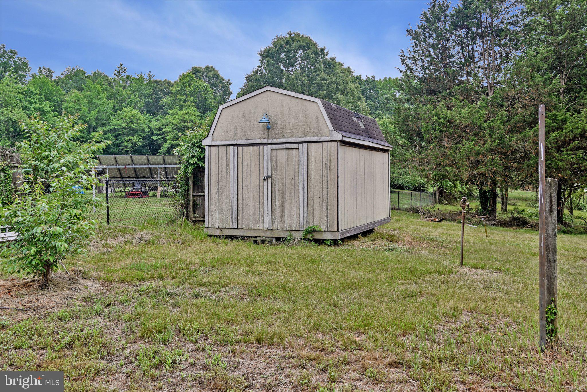 8965 Poorhouse Road Port Tobacco, MD 20677 - Photo 14 of 18 a backyard of a house with lots of green space