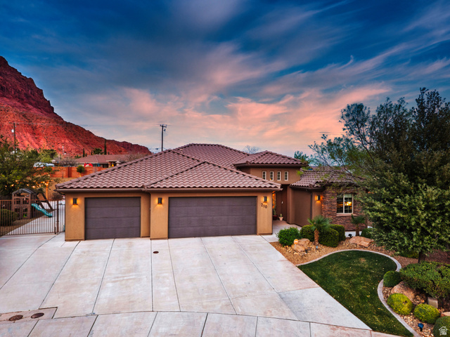 210 Talon Court Ivins, UT 84738 - Photo 3 of 60 Mediterranean / spanish home featuring stucco siding, a garage, driveway, and a tiled roof