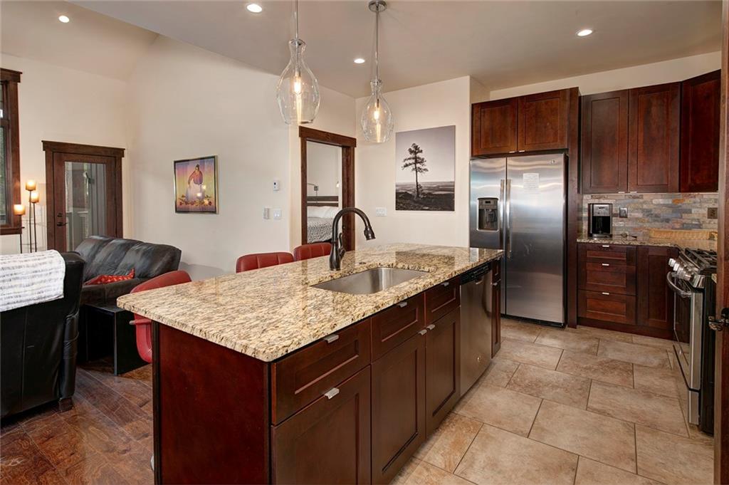 767 Independence Road, Unit 3A Keystone, CO 80435 - Photo 11 of 35 a kitchen with kitchen island granite countertop a counter top space appliances and a center island