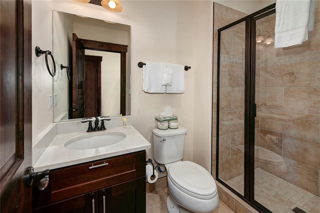 767 Independence Road, Unit 3A Keystone, CO 80435 - Photo 15 of 35 a bathroom with a toilet sink and mirror
