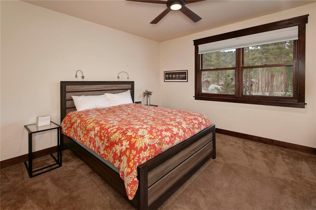 767 Independence Road, Unit 3A Keystone, CO 80435 - Photo 16 of 35 a bed sitting in a bedroom next to a window