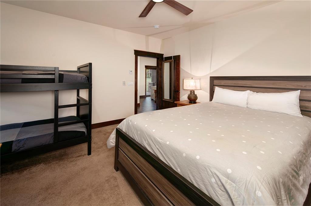 767 Independence Road, Unit 3A Keystone, CO 80435 - Photo 20 of 35 a bedroom with a bed and a ceiling fan