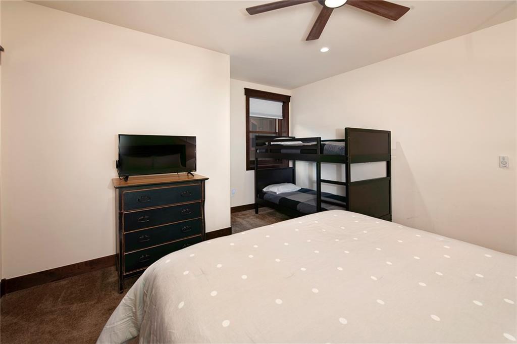 767 Independence Road, Unit 3A Keystone, CO 80435 - Photo 22 of 35 a bedroom with a bed and a flat screen tv