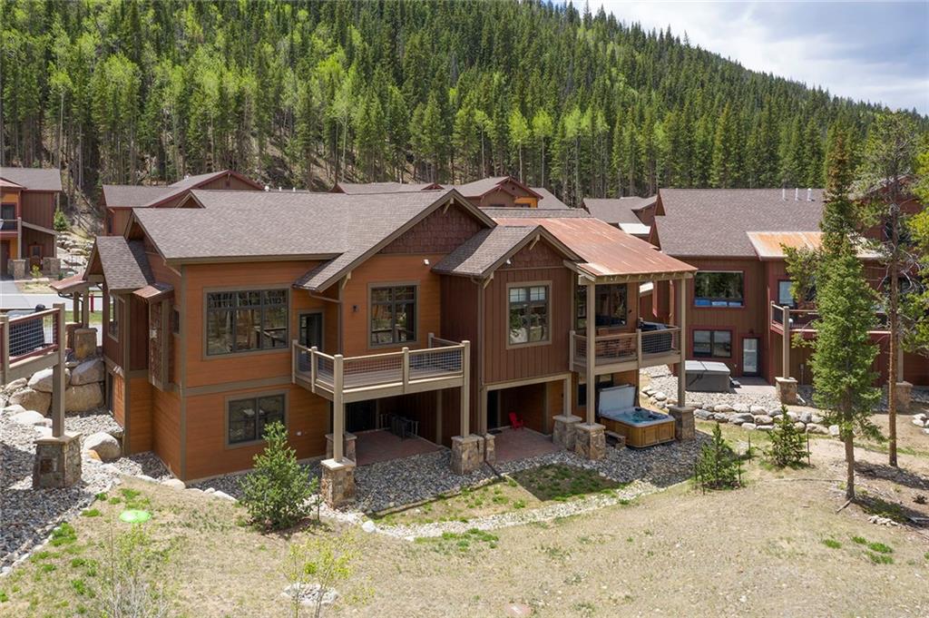 767 Independence Road, Unit 3A Keystone, CO 80435 - Photo 32 of 35 an aerial view of a house with a yard table and chairs