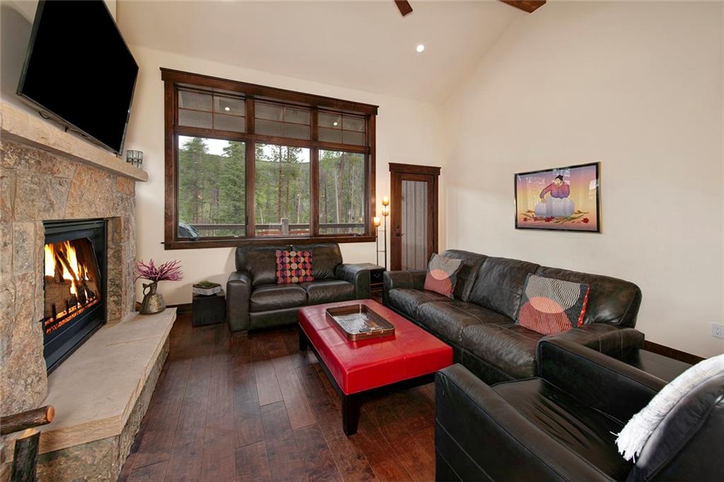 767 Independence Road, Unit 3A Keystone, CO 80435 - Photo 5 of 35 a living room with furniture large window and a fireplace
