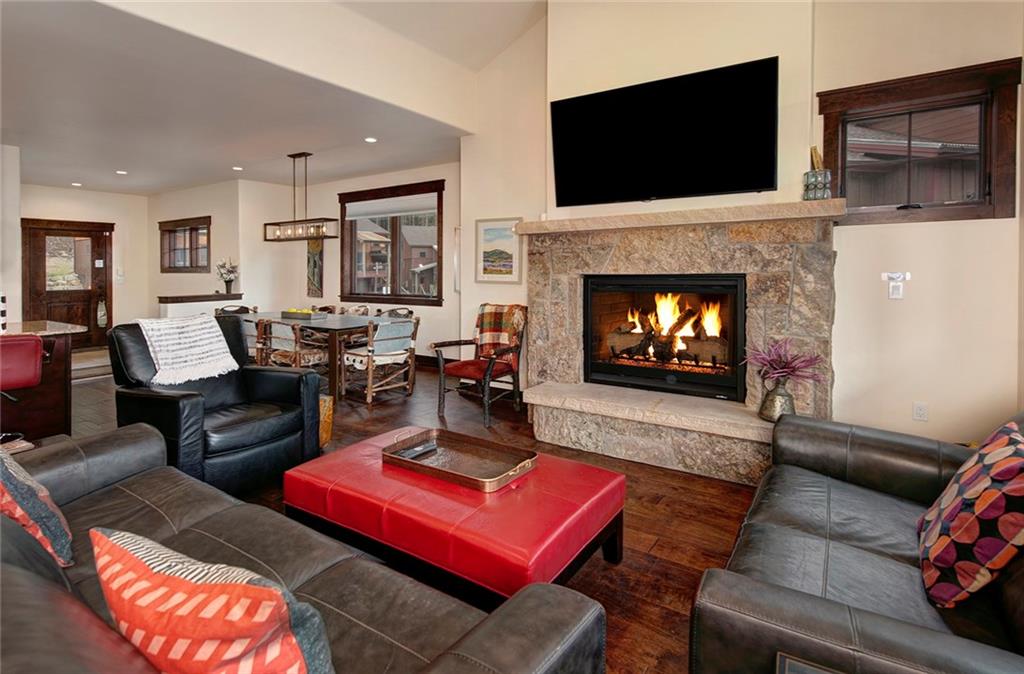767 Independence Road, Unit 3A Keystone, CO 80435 - Photo 6 of 35 a living room with furniture a flat screen tv and a fireplace