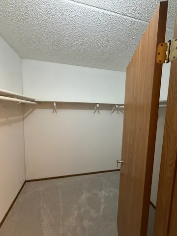 a kitchen with stainless steel appliances a sink stove and cabinets