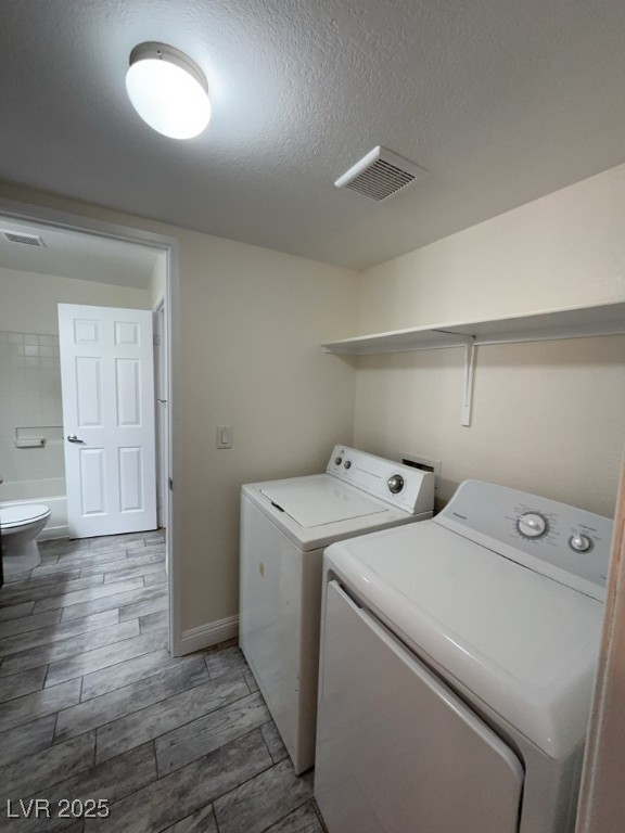 6800 East Lake Mead Boulevard, Unit 2024 Las Vegas, NV 89156 - Photo 11 of 12 Laundry area with washer and clothes dryer