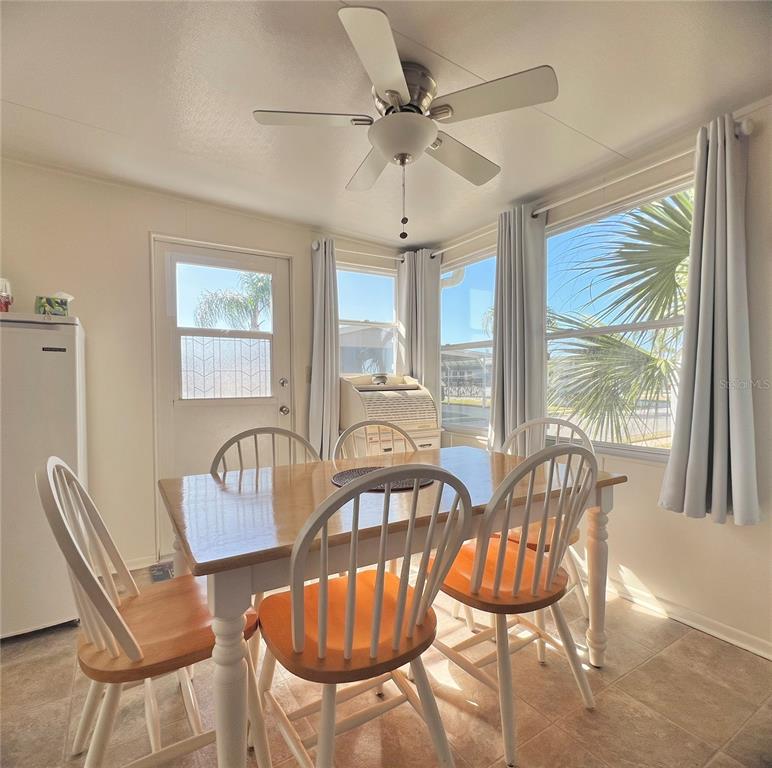 1100 South Belcher Road, Unit 23 Largo, FL 33771 - Photo 12 of 87 a view of a dining room with furniture window and outside view
