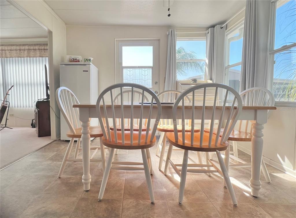 1100 South Belcher Road, Unit 23 Largo, FL 33771 - Photo 13 of 87 a view of a dining room with furniture window and outside view