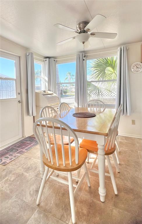 1100 South Belcher Road, Unit 23 Largo, FL 33771 - Photo 17 of 87 a view of a dining room with furniture window and outside view