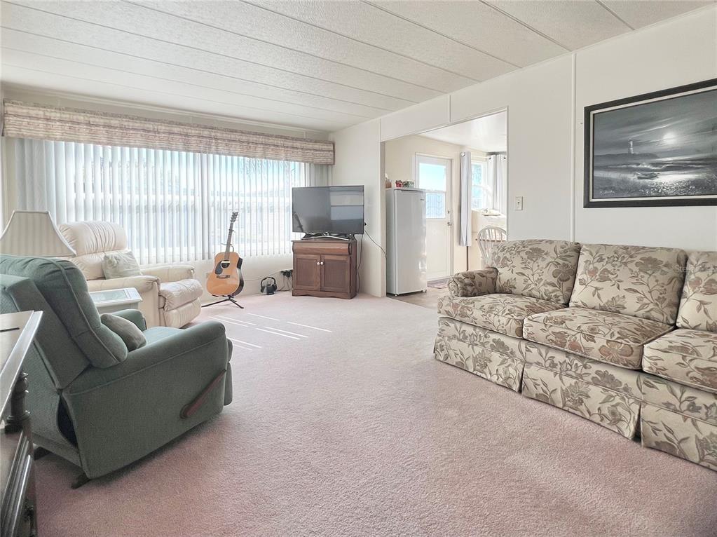 1100 South Belcher Road, Unit 23 Largo, FL 33771 - Photo 18 of 87 a living room with furniture and a large window