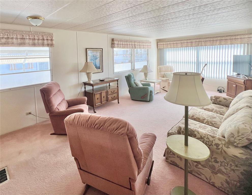 1100 South Belcher Road, Unit 23 Largo, FL 33771 - Photo 28 of 87 a living room with furniture and a window