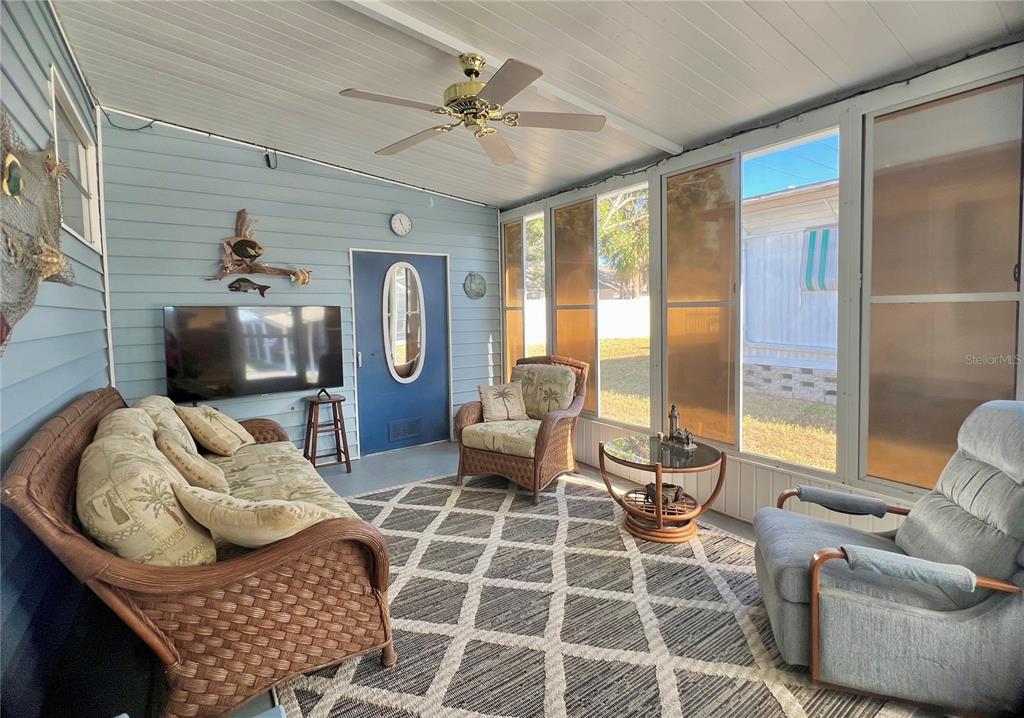 1100 South Belcher Road, Unit 23 Largo, FL 33771 - Photo 37 of 87 a living room with furniture and a flat screen tv