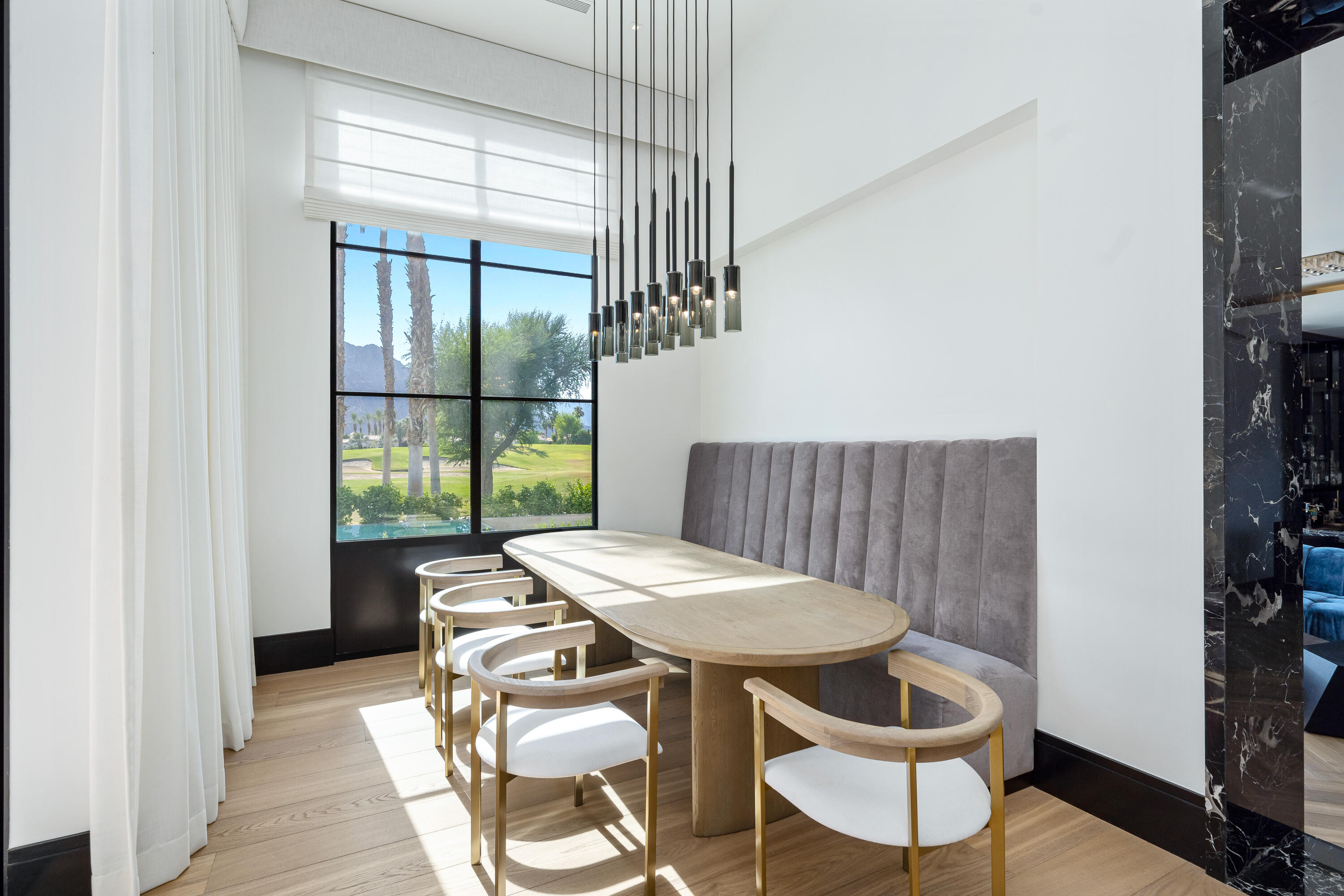 53747 Via Strada La Quinta, CA 92253 - Photo 18 of 59 a view of a dining room with furniture window and wooden floor