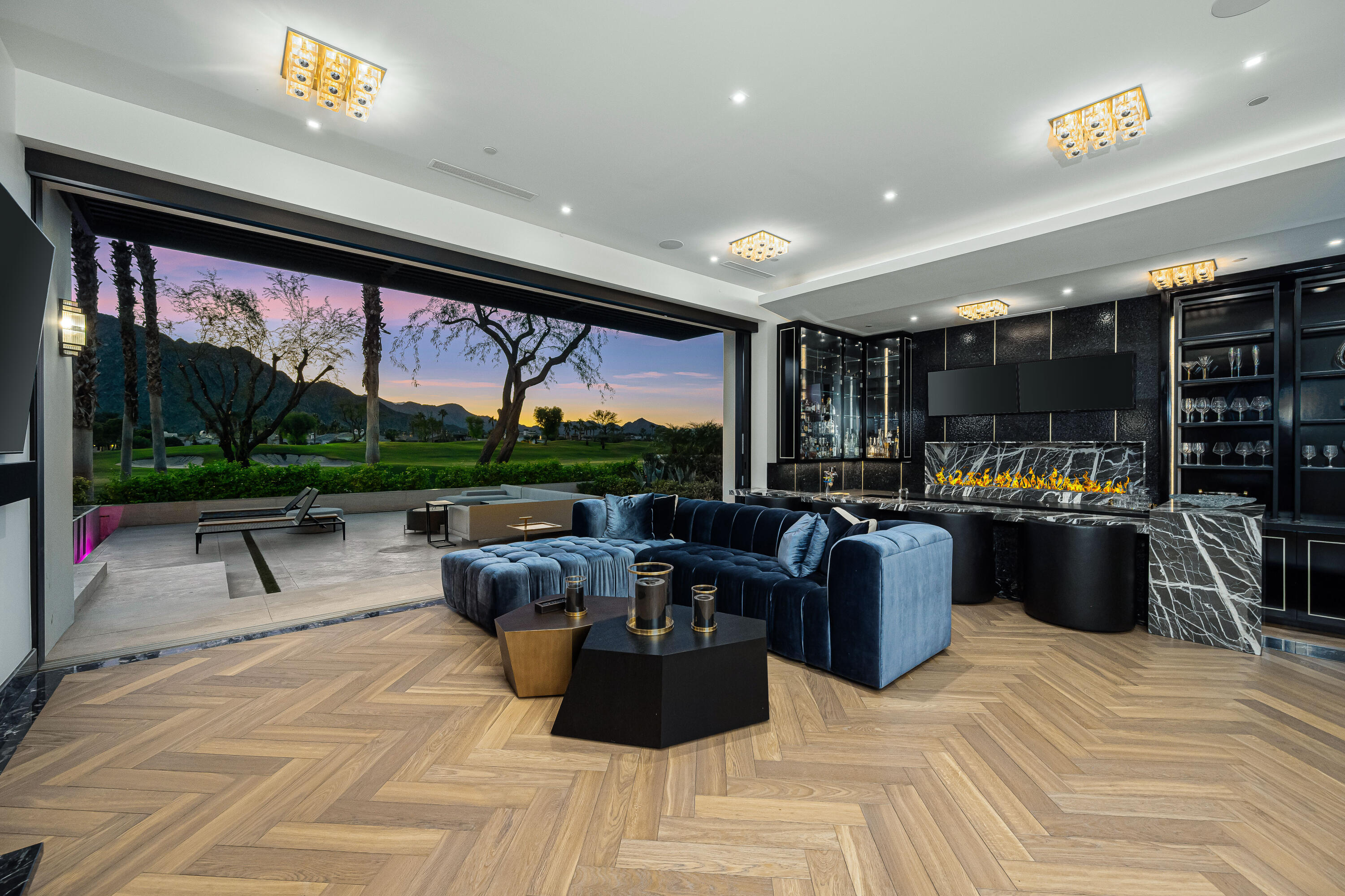 53747 Via Strada La Quinta, CA 92253 - Photo 22 of 59 a living room with patio furniture and a flat screen tv