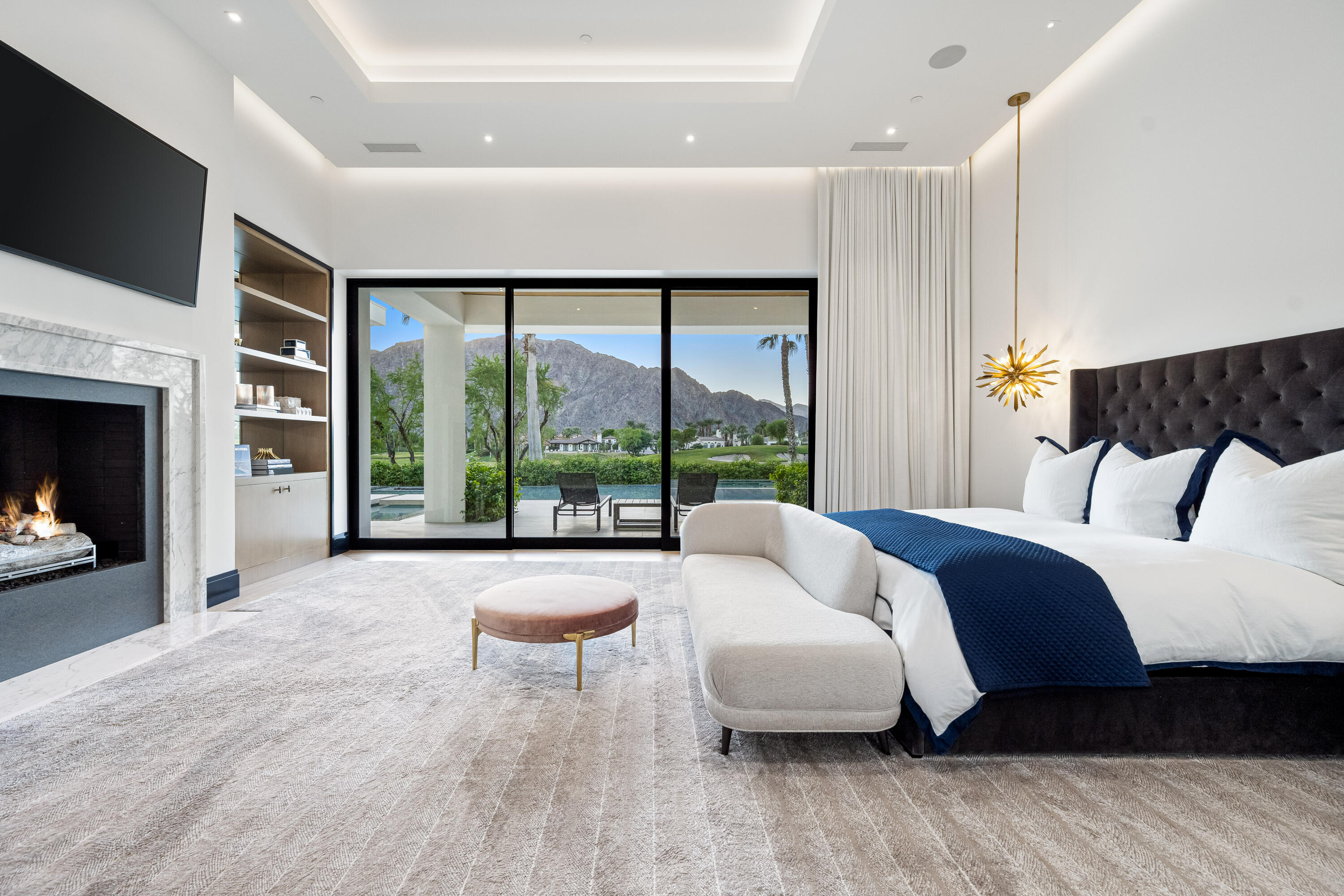 53747 Via Strada La Quinta, CA 92253 - Photo 28 of 59 a spacious bedroom with a bed and a large window