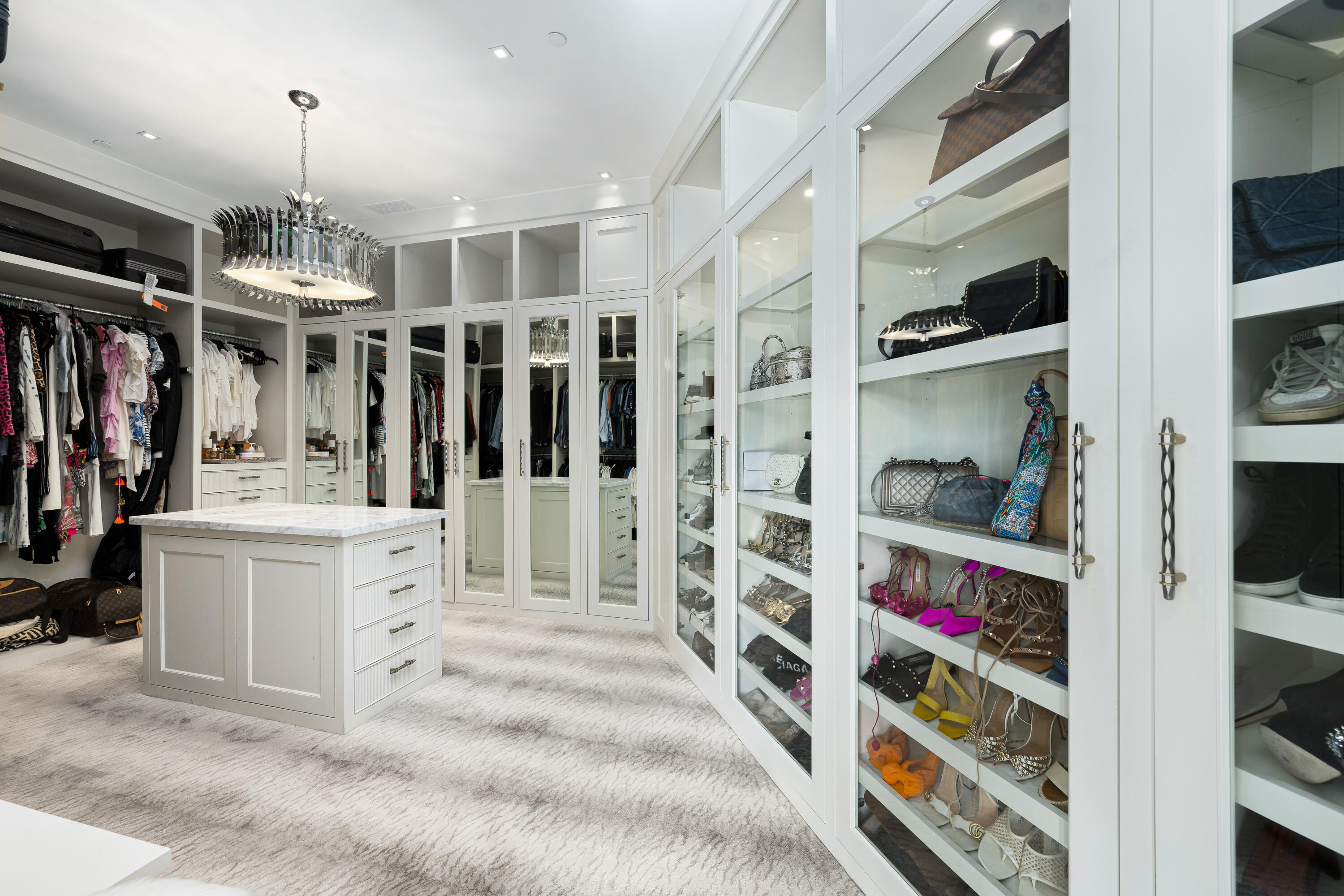 53747 Via Strada La Quinta, CA 92253 - Photo 32 of 59 a view of walk in closet with clothes and shoes