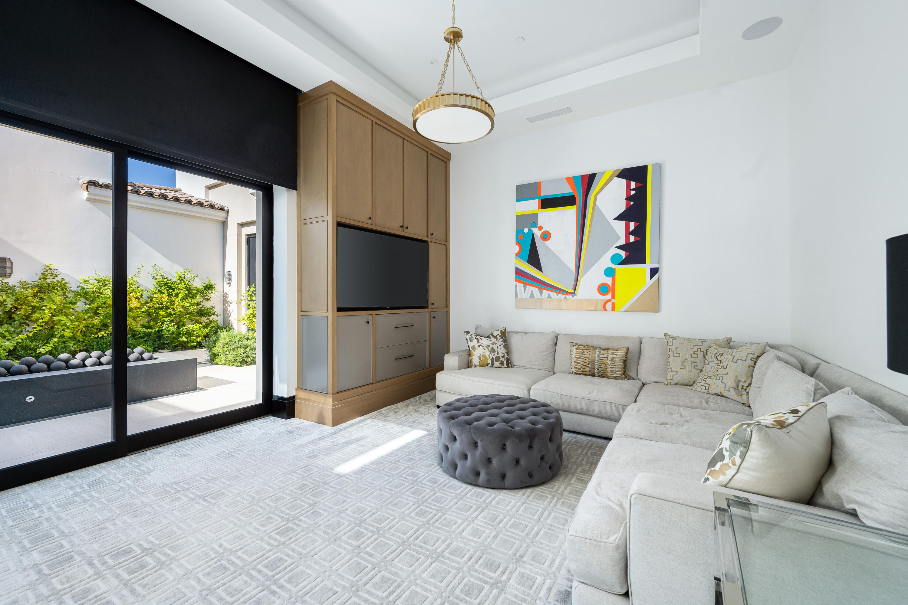 53747 Via Strada La Quinta, CA 92253 - Photo 33 of 59 a living room with furniture and a flat screen tv
