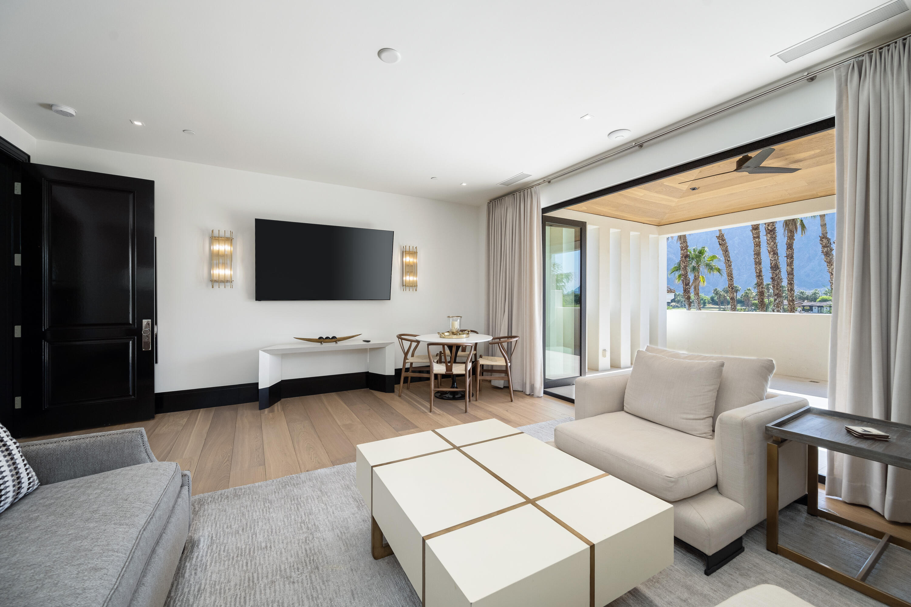 53747 Via Strada La Quinta, CA 92253 - Photo 36 of 59 a living room with furniture and a flat screen tv