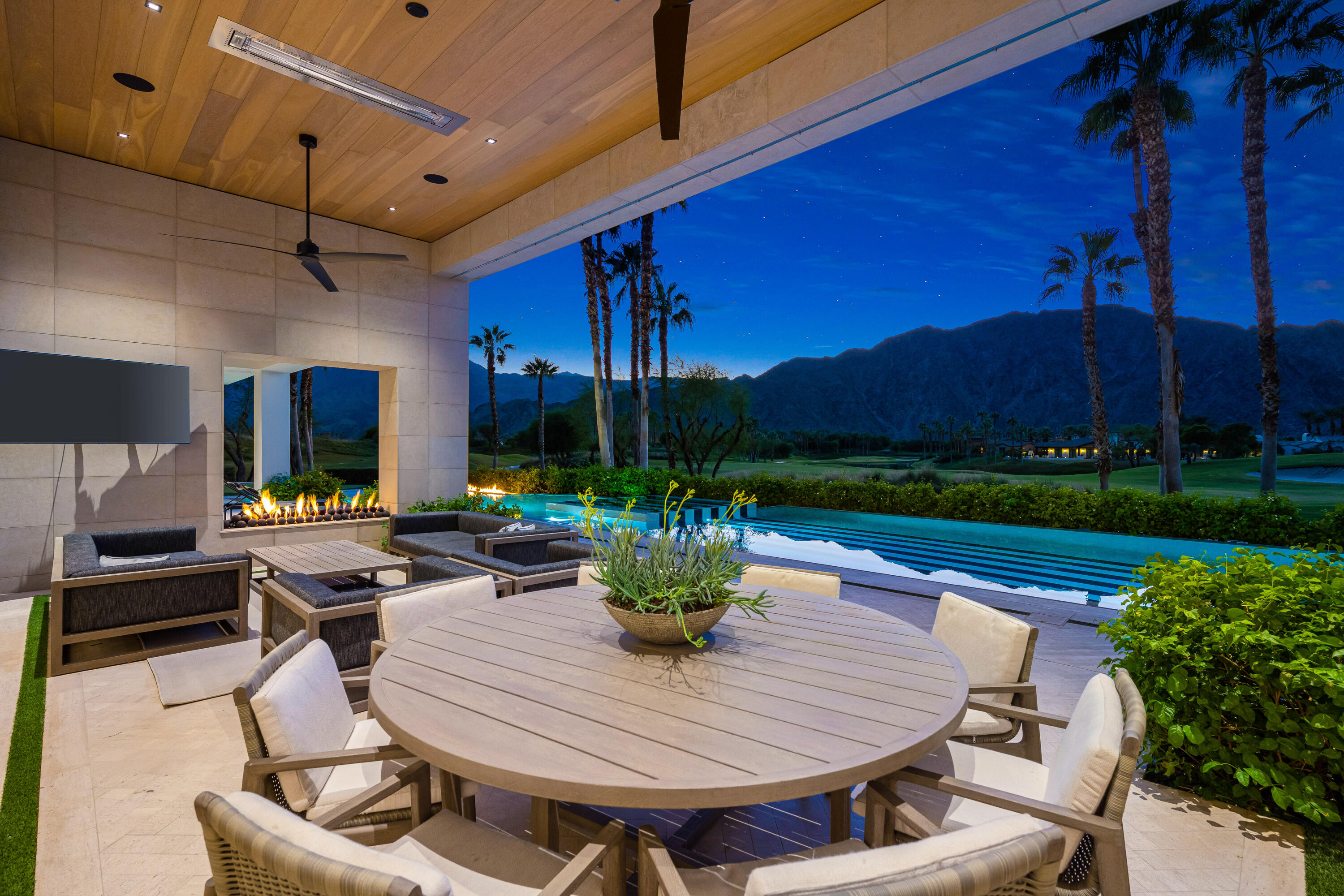 53747 Via Strada La Quinta, CA 92253 - Photo 47 of 59 a view of a dining room with furniture a chandelier and wooden floor