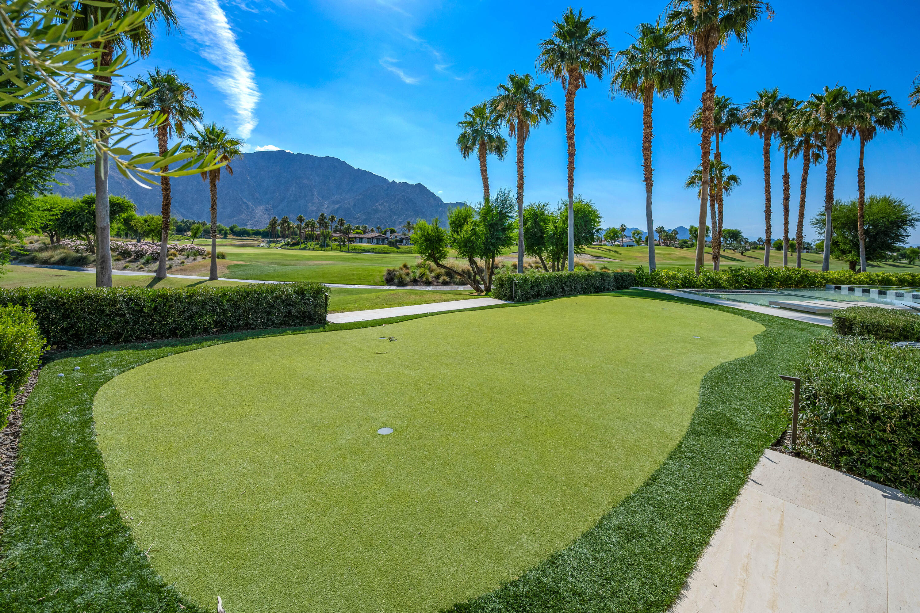 53747 Via Strada La Quinta, CA 92253 - Photo 56 of 59 a view of a house with a yard and palm trees