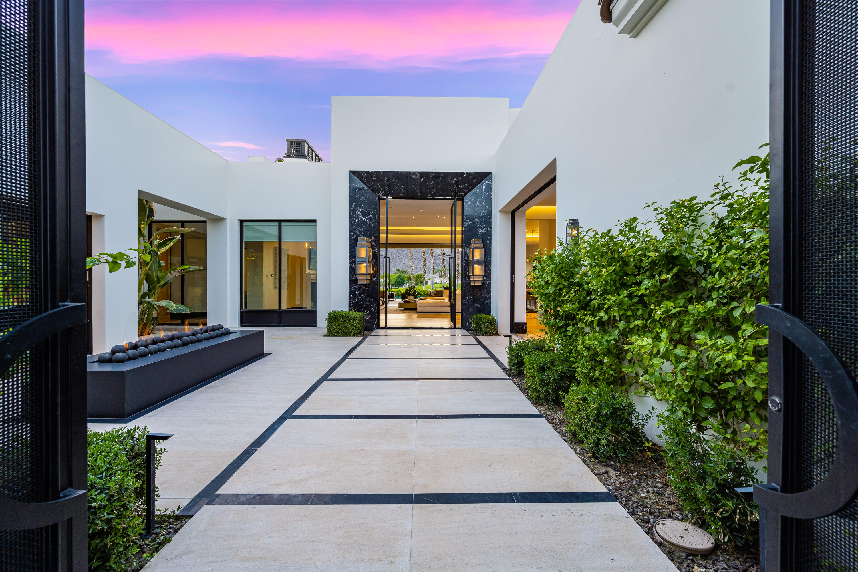 53747 Via Strada La Quinta, CA 92253 - Photo 6 of 59 a view of an entryway with flower pots