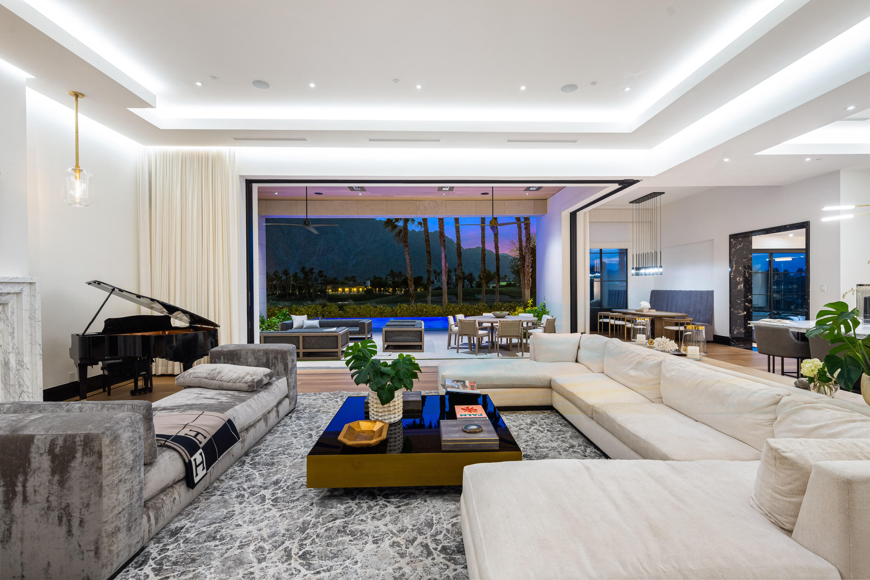 53747 Via Strada La Quinta, CA 92253 - Photo 9 of 59 a living room with furniture and a large window
