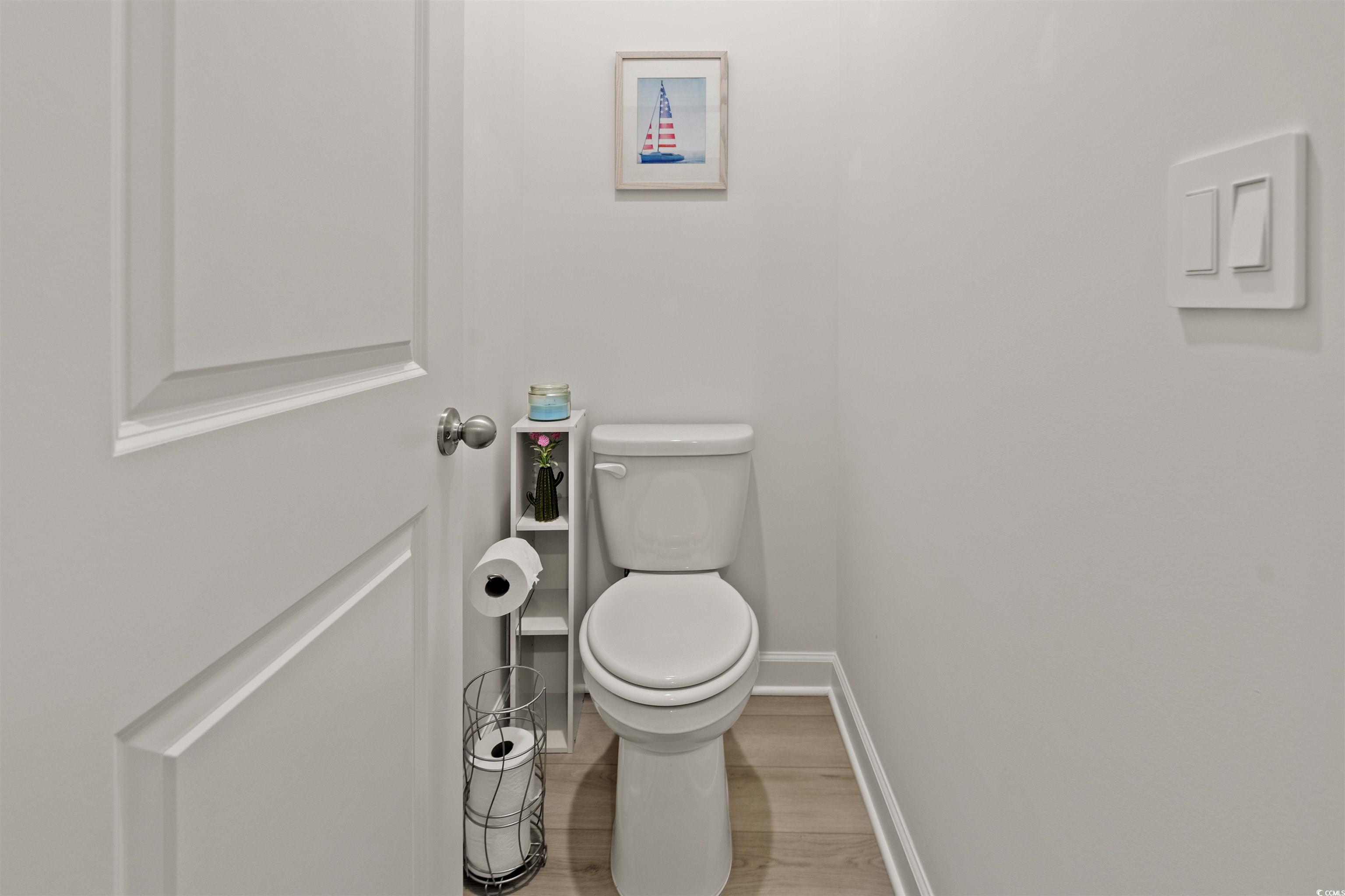 1546 Regal Fern Way Longs, SC 29568 - Photo 16 of 34 Bathroom with toilet and wood finished floors