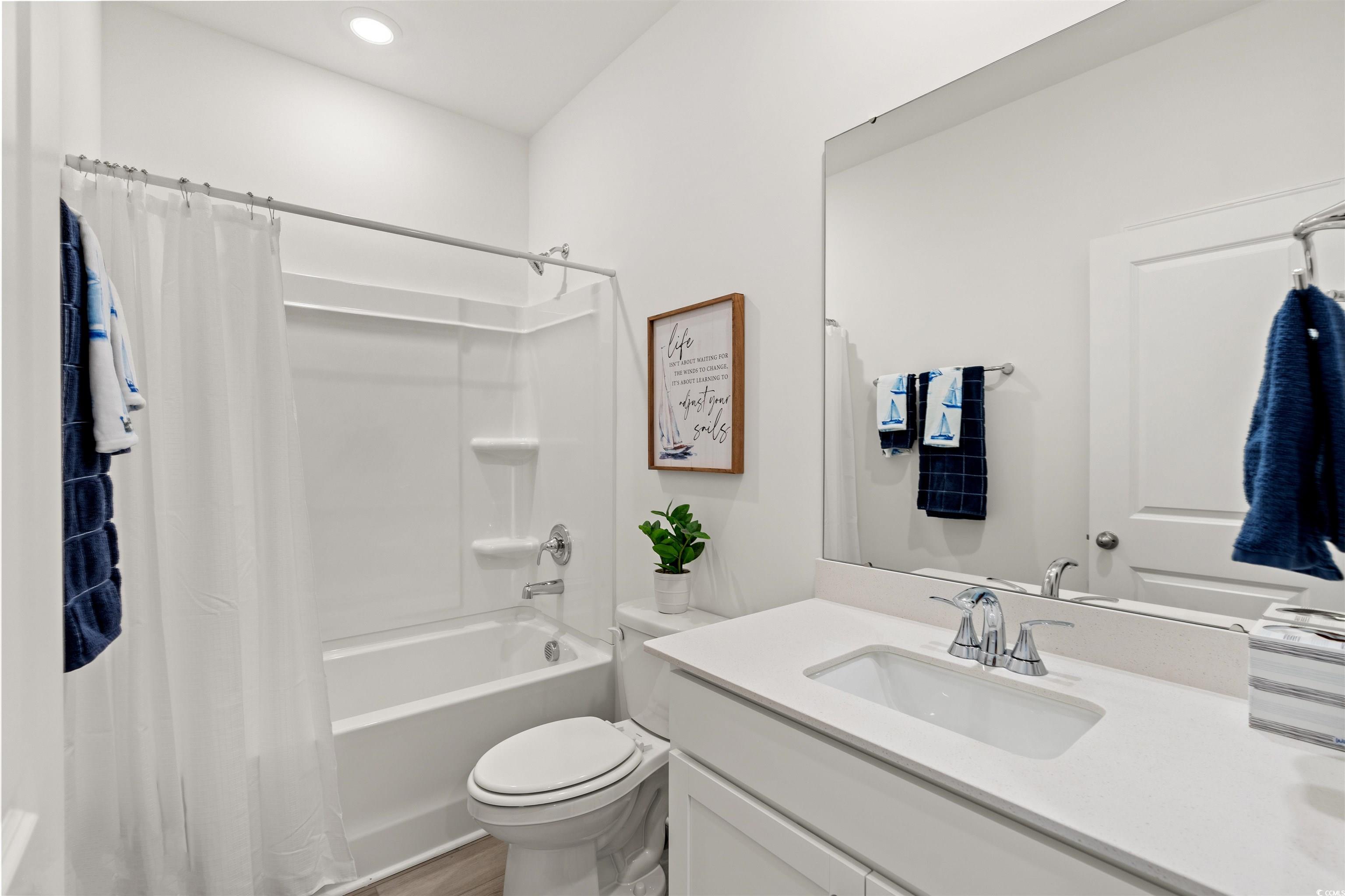 1546 Regal Fern Way Longs, SC 29568 - Photo 20 of 34 Bathroom featuring vanity, shower / bathtub combination with curtain, and recessed lighting