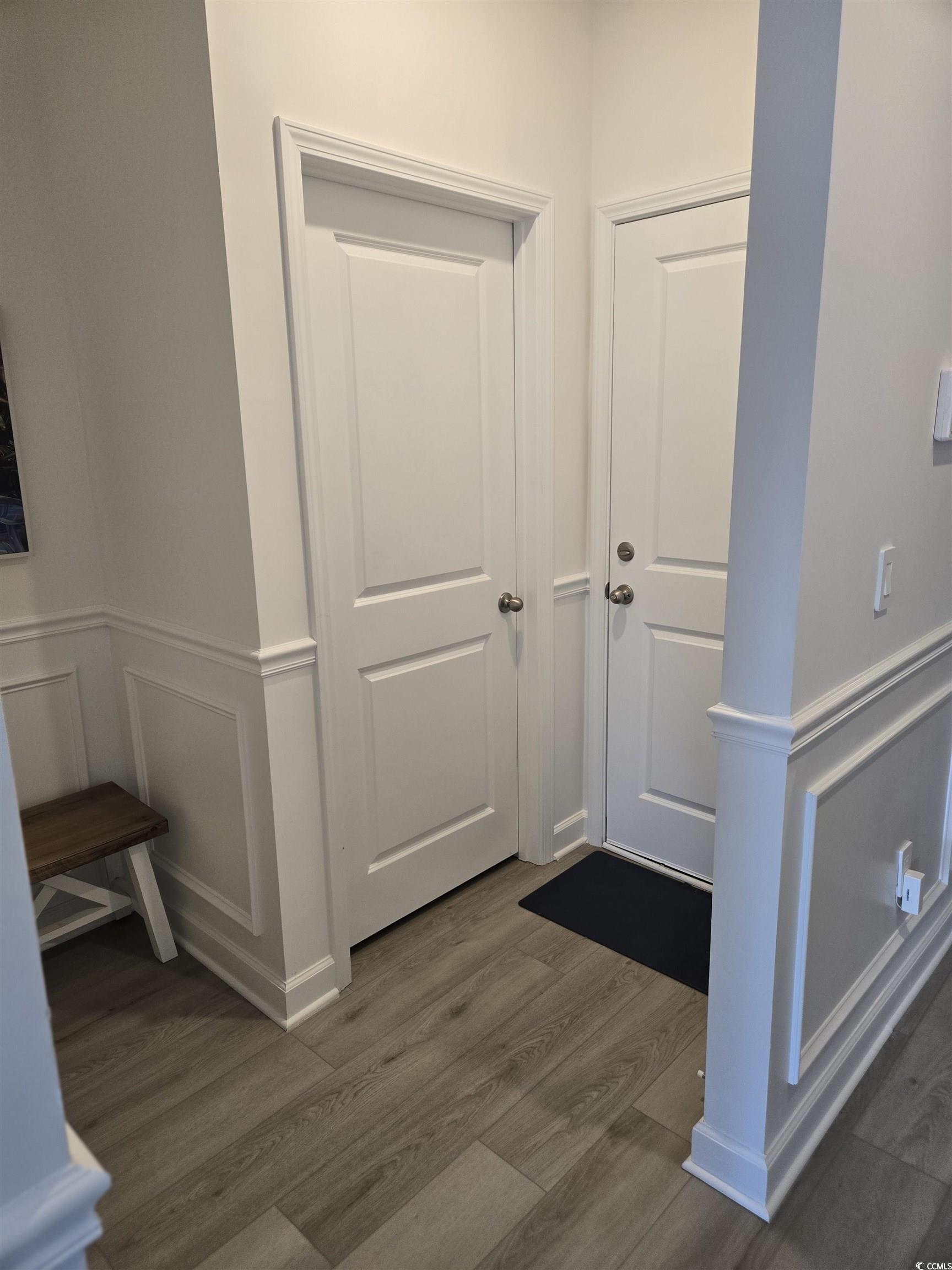 1546 Regal Fern Way Longs, SC 29568 - Photo 23 of 34 Foyer with a decorative wall, wainscoting, and dark wood finished floors