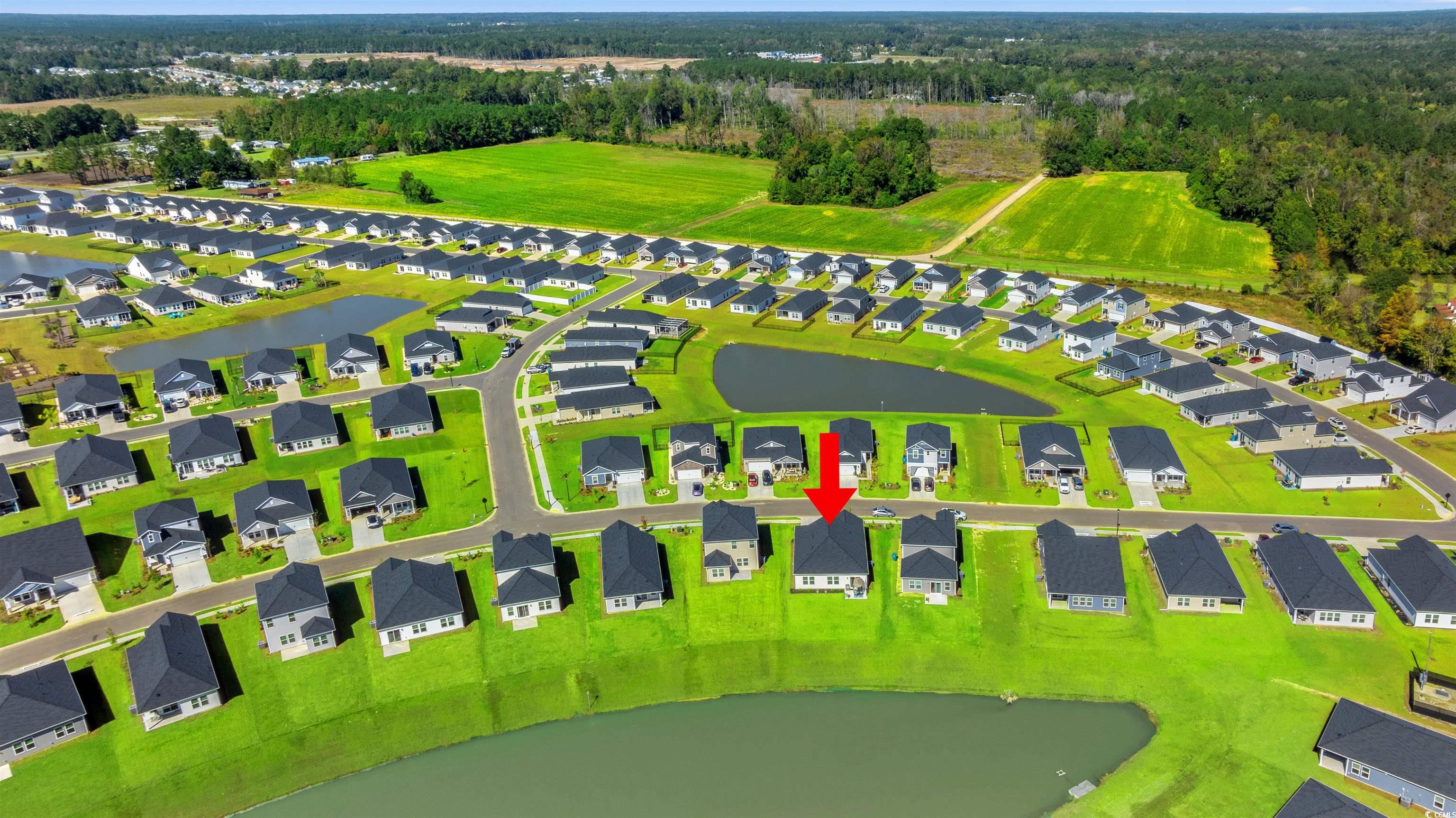 1546 Regal Fern Way Longs, SC 29568 - Photo 27 of 34 Aerial view of residential area with a large body of water