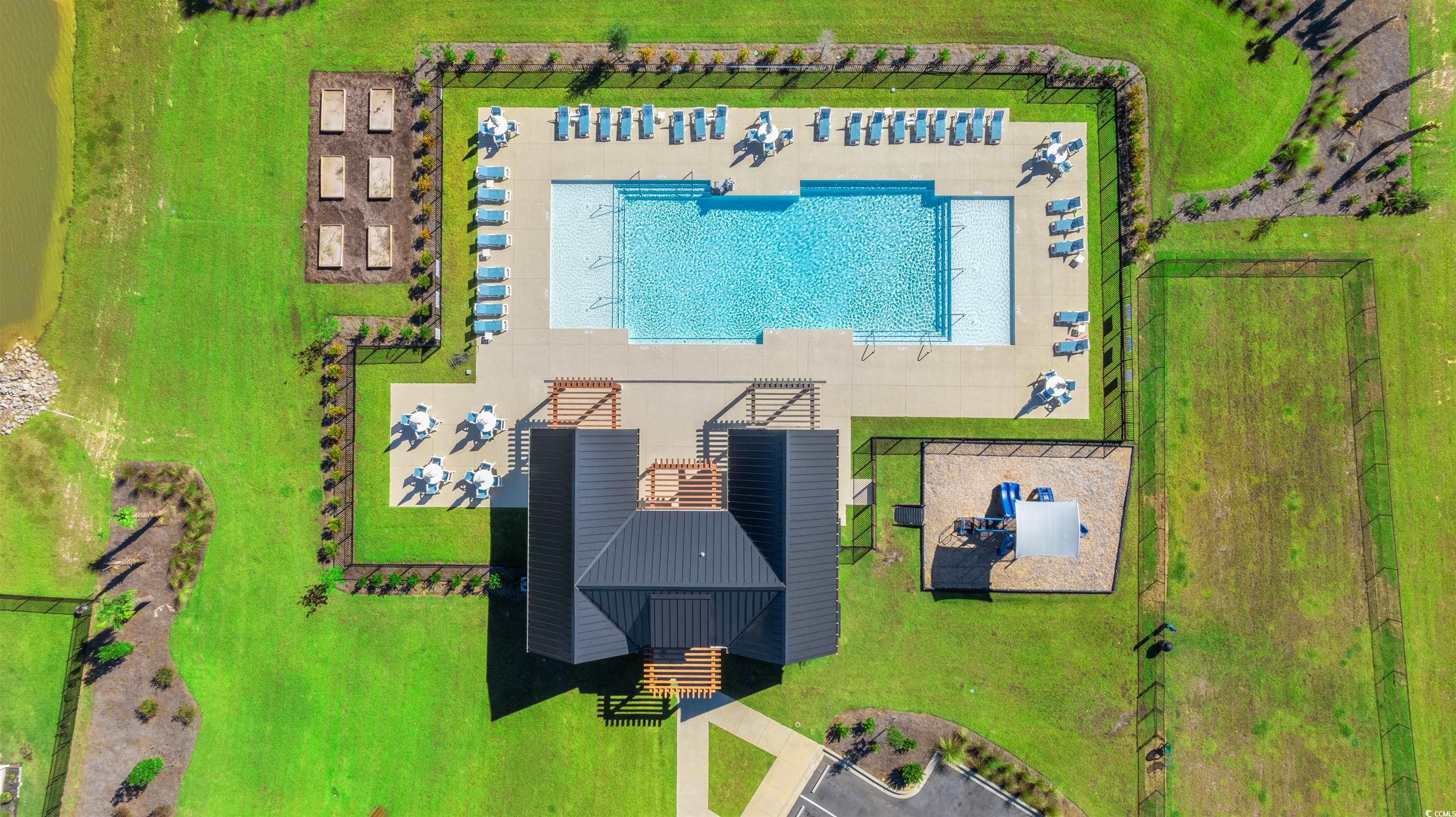 1546 Regal Fern Way Longs, SC 29568 - Photo 30 of 34 Drone / aerial view of a pool