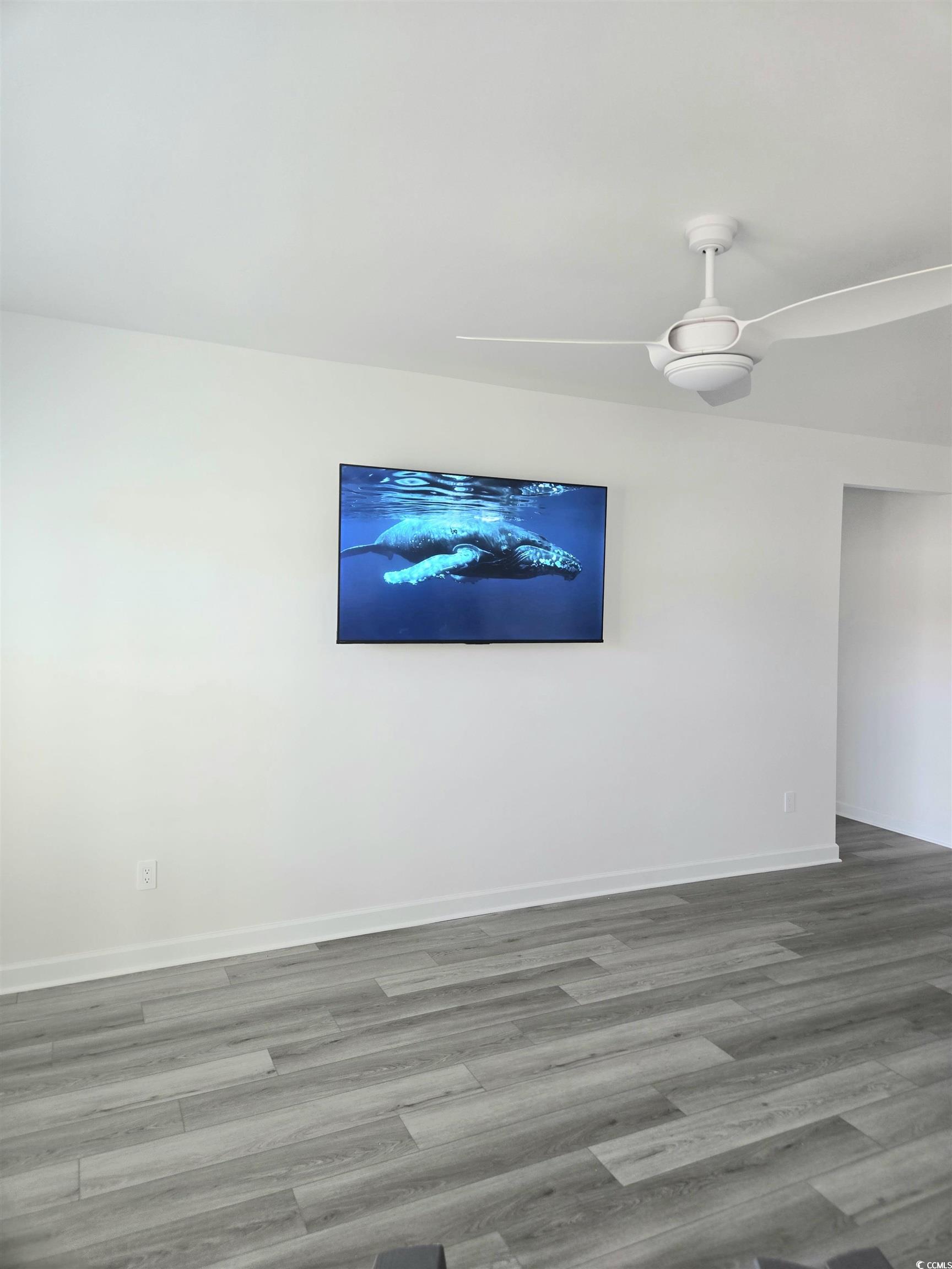 1546 Regal Fern Way Longs, SC 29568 - Photo 10 of 34 Spare room featuring wood finished floors and ceiling fan