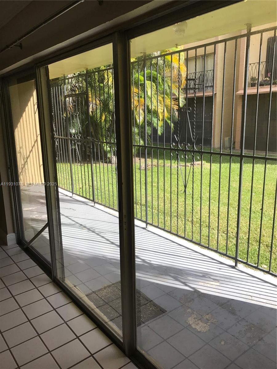 100 Northwest 87th Avenue, Unit E102 Miami, FL 33172 - Photo 15 of 17 a view of a street from a window
