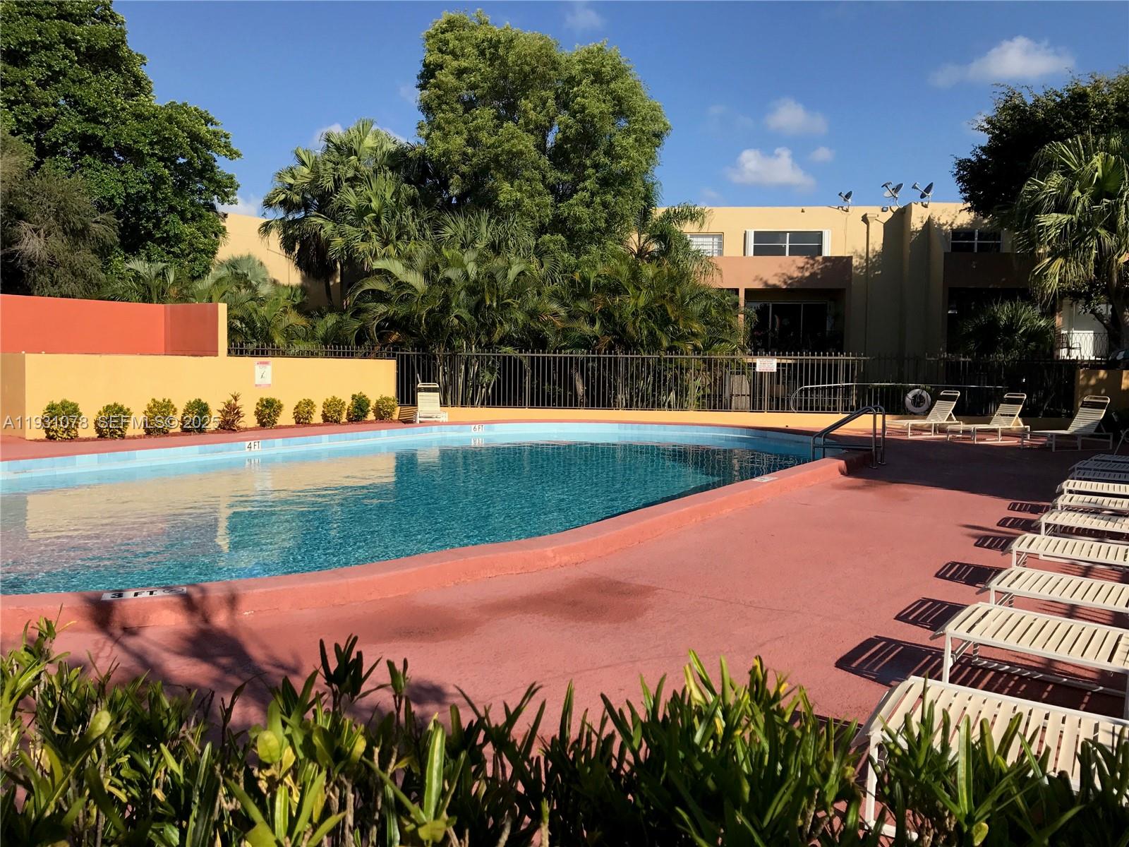 100 Northwest 87th Avenue, Unit E102 Miami, FL 33172 - Photo 17 of 17 an outdoor space with lounge chair