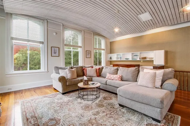 a living room with furniture and a table
