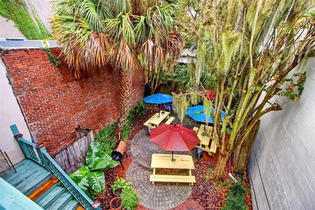 an aerial view of a houses with yard