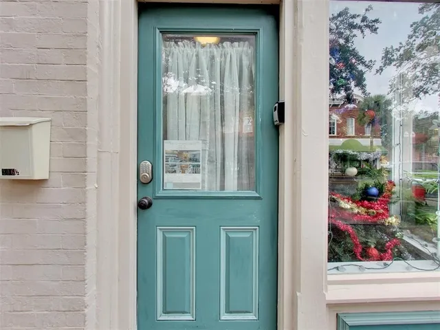 a view of front door of house and yard