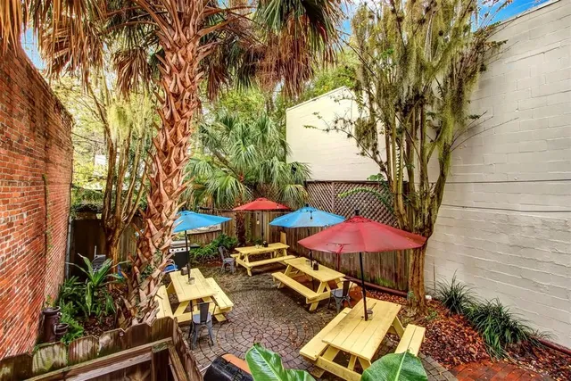 an outdoor space with furniture and umbrella