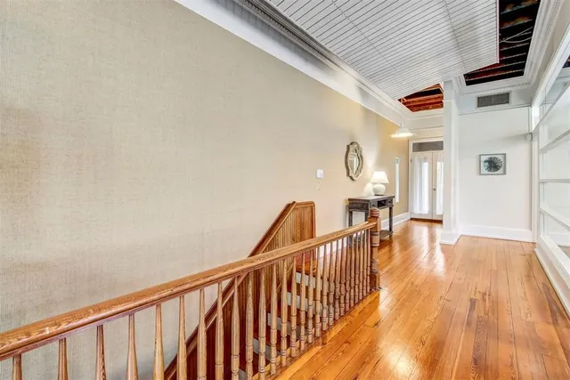 a view of balcony with wooden floor