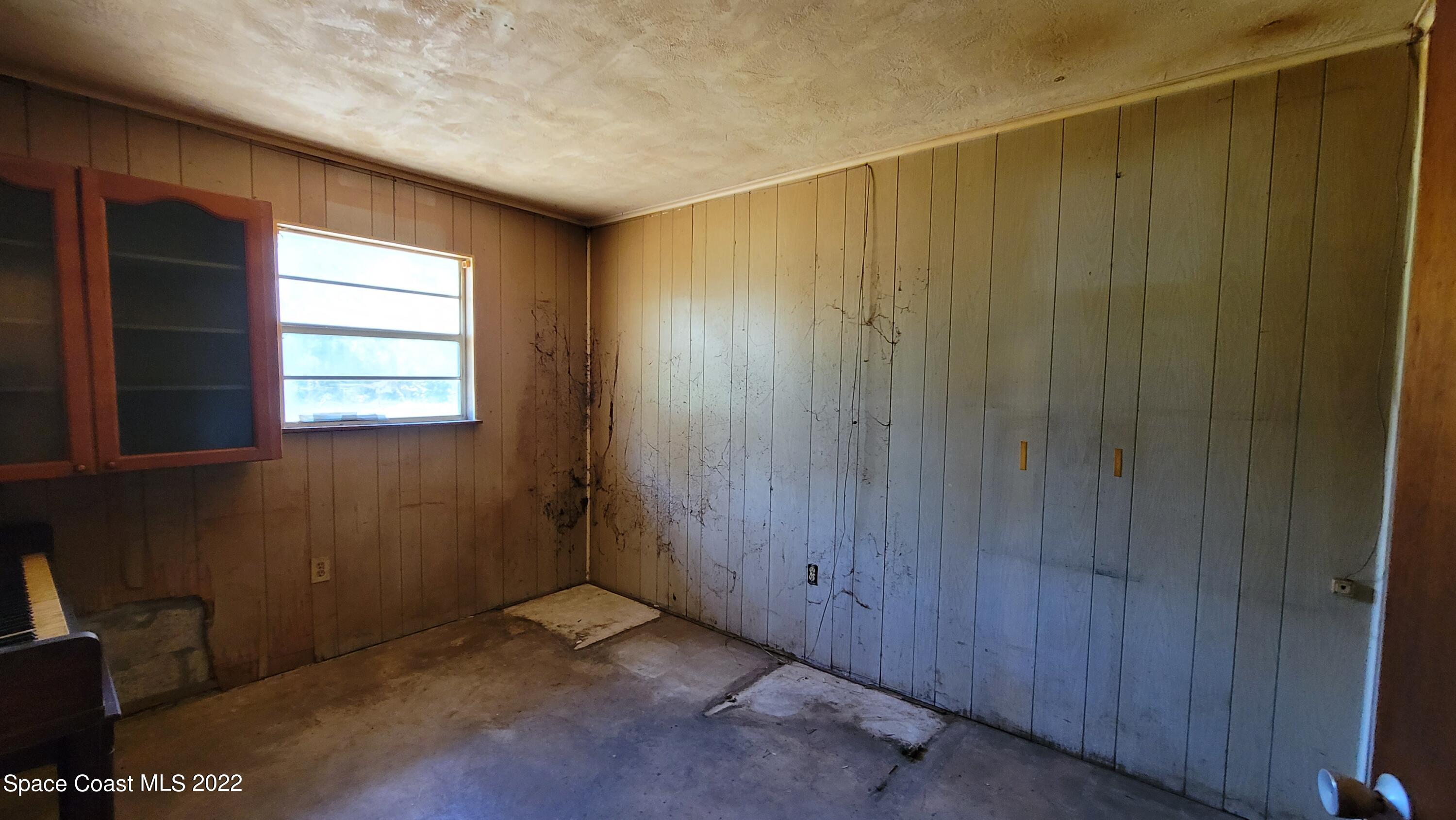 1910 Atz Road Malabar, FL 32950 - Photo 27 of 58 a view of an empty room and window