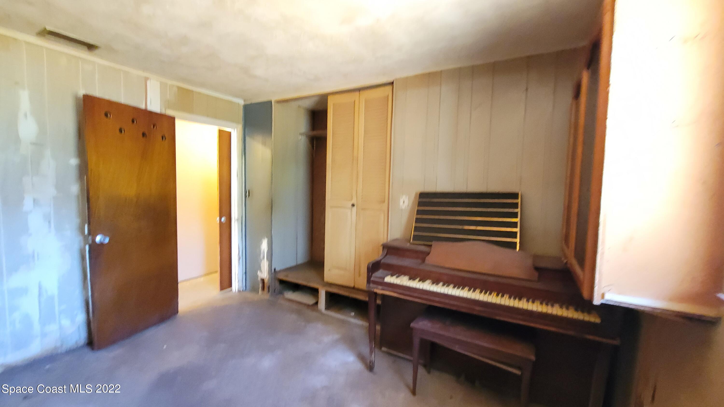 1910 Atz Road Malabar, FL 32950 - Photo 28 of 58 a view of room with wooden floor