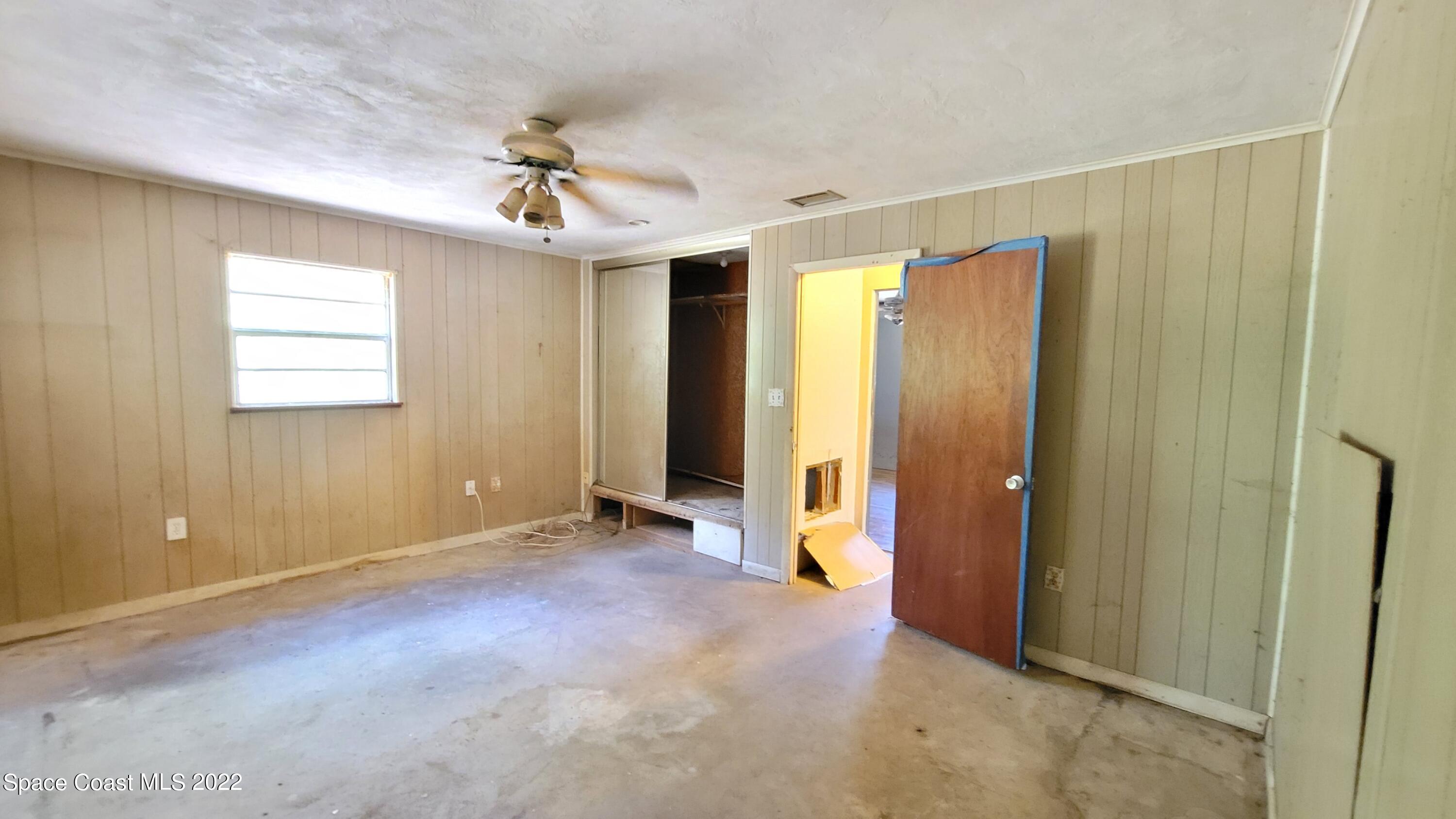 1910 Atz Road Malabar, FL 32950 - Photo 33 of 58 wooden floor in an empty room with a window