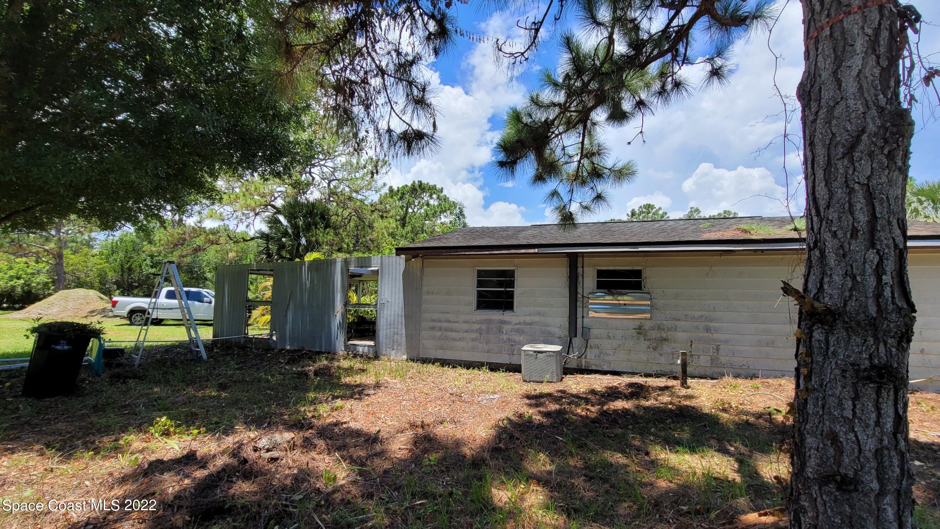 1910 Atz Road Malabar, FL 32950 - Photo 4 of 58 a view of backyard of house with seating space