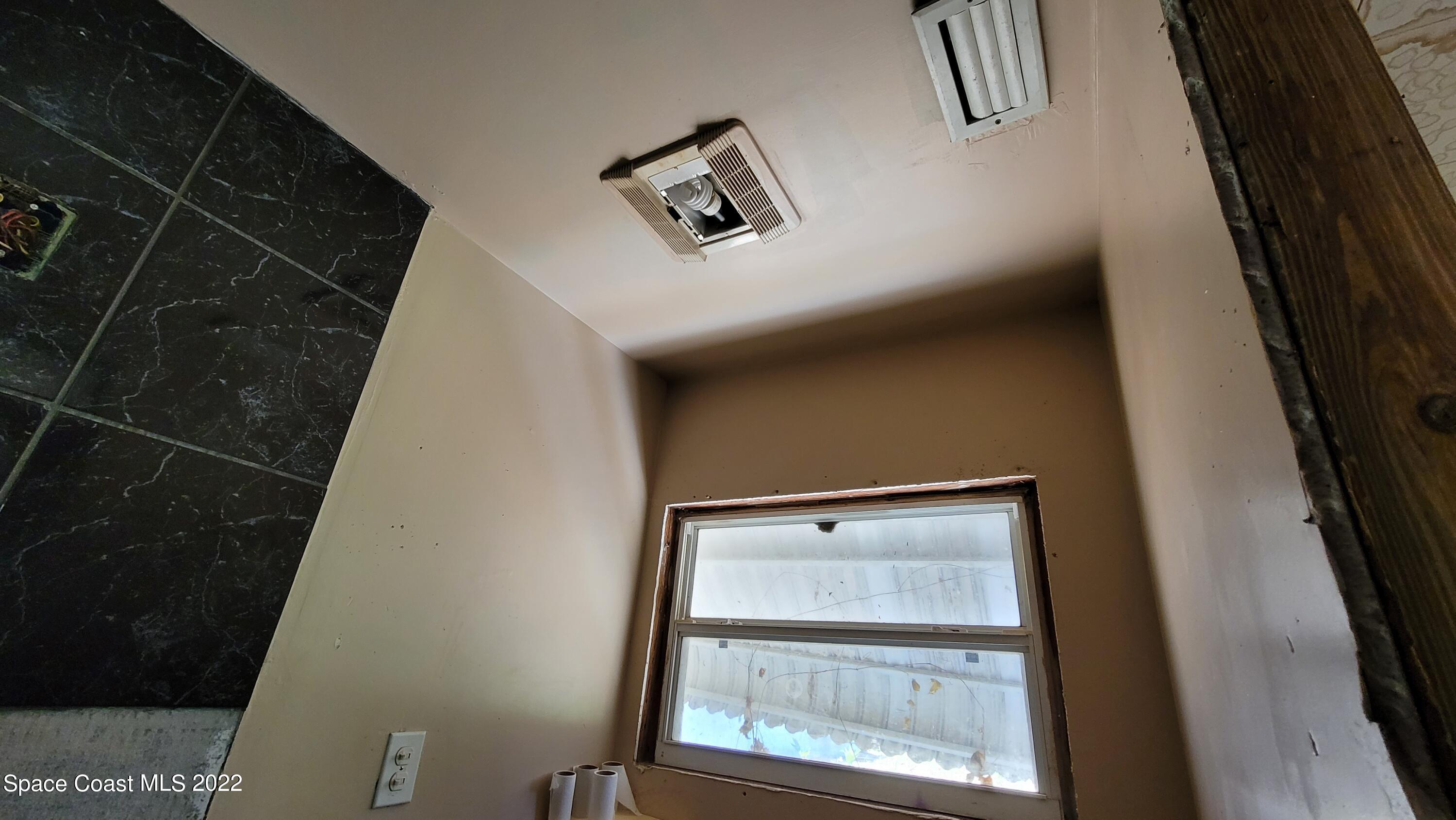 1910 Atz Road Malabar, FL 32950 - Photo 53 of 58 a view of staircase with window